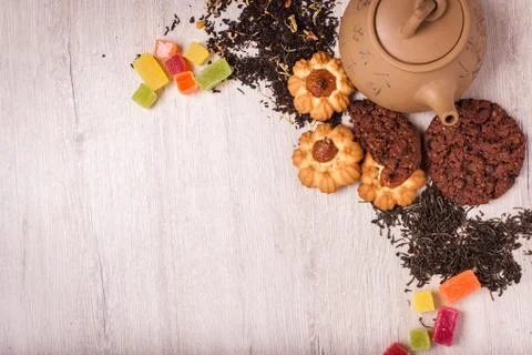 The composition of the tea on a wooden surface. brown teapot from clay with.. Stock-Fotos