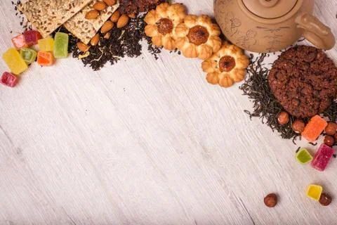 The composition of the tea on a wooden surface. brown teapot from clay with.. Stock Photos
