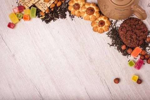 The composition of the tea on a wooden surface. brown teapot from clay with.. Stock Photos