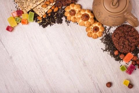 The composition of the tea on a wooden surface. brown teapot from clay with.. Stock Photos