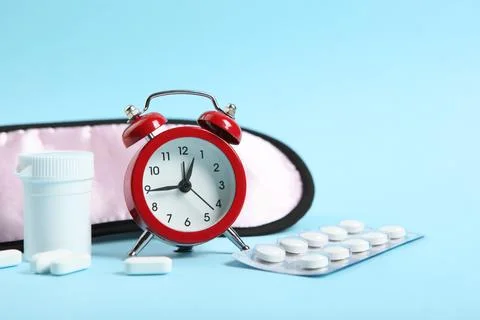 Composition on the theme of insomnia on a colored background Stock-Fotos