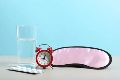 Composition on the theme of insomnia on a colored background Stock-Fotos