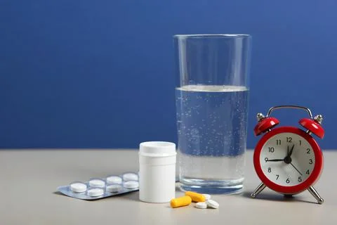 Composition on the theme of insomnia on a colored background Stock Photos