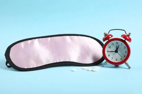 Composition on the theme of insomnia on a colored background Stockfoto's