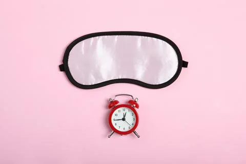 Composition on the theme of insomnia on a colored background Stock-Fotos