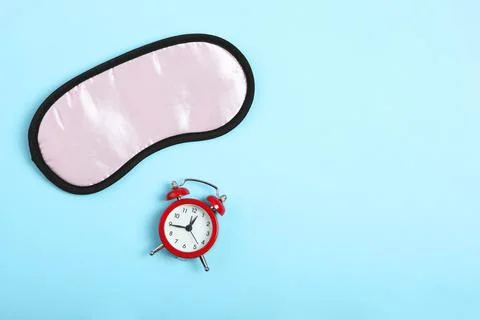 Composition on the theme of insomnia on a colored background Stockfoto's