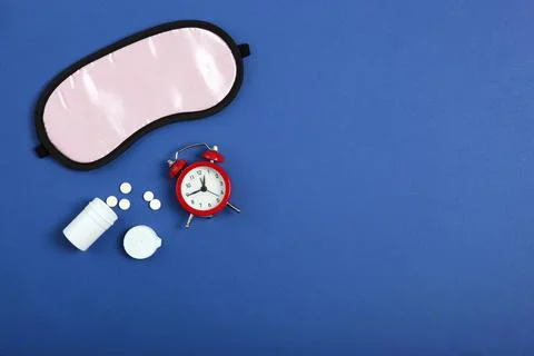 Composition on the theme of insomnia on a colored background Stock Photos