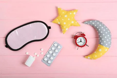 Composition on the theme of insomnia on a colored background Stockfoto's