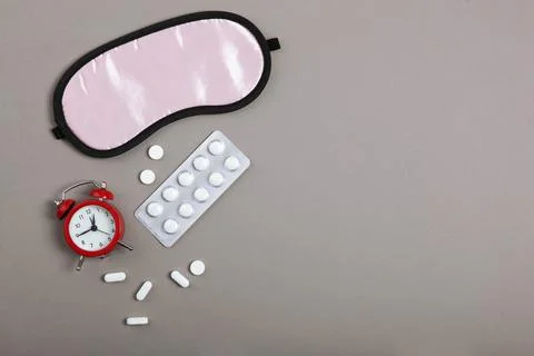 Composition on the theme of insomnia on a colored background Stock Photos