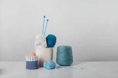 Composition of threads and rollers on a white background. Knitting kit Stock Photos