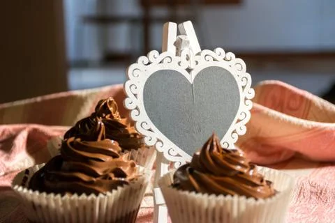 Composition of Three Chocolate Cup Cakes and a Heart-Shaped Blackboard Stock Photos