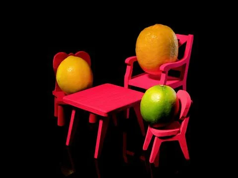 Composition with three lemons at the table on a black background Stock Photos