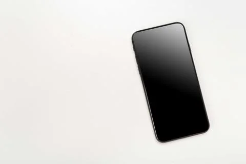 Composition top view on wooden table with modern mobile phone. mock up, empty Stock Photos