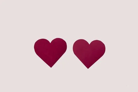Composition of two red paper hearts on a white isolated background valentine's Foto stock