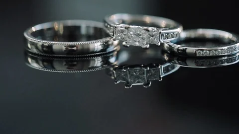 Composition Of Two Wedding Rings And Engagement Ring. Video stock 107327862