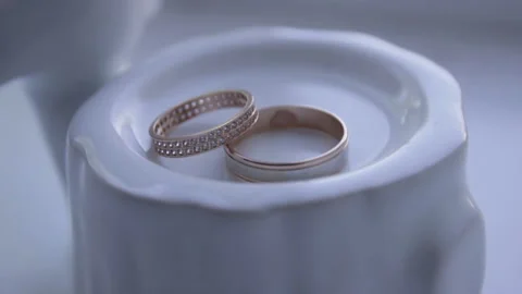 Composition of two wedding rings at the table. Stock Footage 113355158