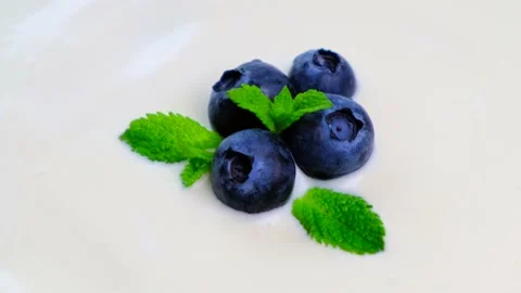 Composition of a typical real breakfast of yogurt, blueberries. Stock Footage 155690183