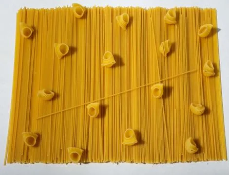 Composition of undigested macaroni pasta made with hard light on a white Stock Photos