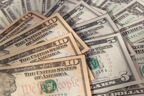 Composition of US Dollar Banknotes with Focus on Ten Dollar Bills Stock Photos