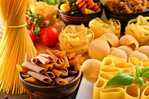Composition with variety of pasta on kitchen table. Foto stock