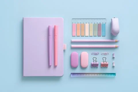 Composition of various school and office stationery in pastel pink and purple Stock Photos