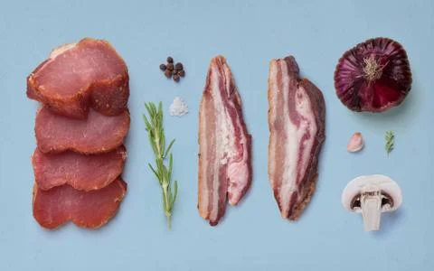 Composition of vegetables and meat isolated on a blue background Stock Photos