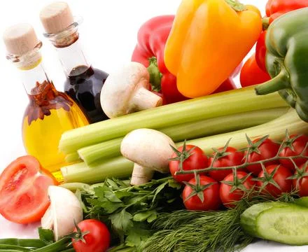 Composition with vegetables and salad dressing Stock Photos