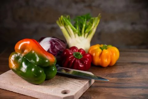 Composition of vegetables with bark and cutting board 스톡 사진