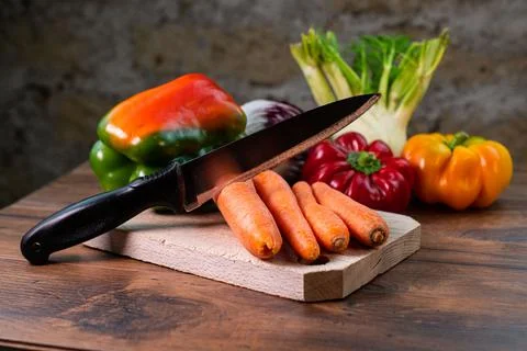 Composition of vegetables with bark and cutting board 스톡 사진