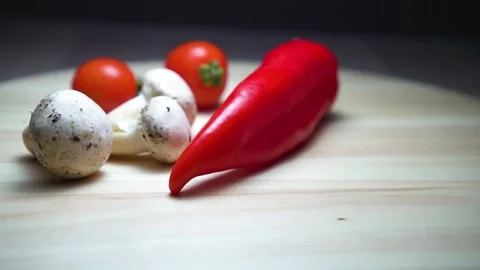 Composition of vegetables on a wooden board. Video stock 169625658