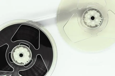 Composition of video home system VHS tape reels on white background Stock Photos