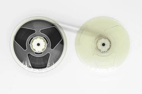 Composition of video home system VHS tape reels on white background Foto stock