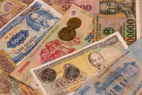 A composition of Vietnamese dong VND banknotes and coins Stock Photos
