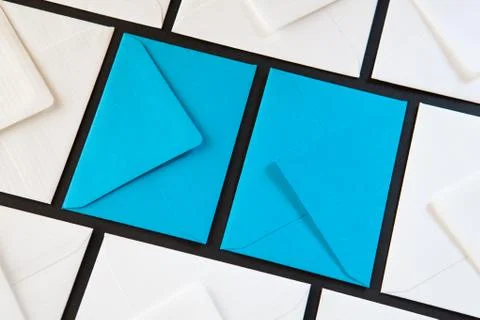 Composition with white and blue envelopes on the table. Photos