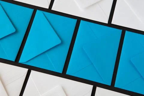 Composition with white and blue envelopes on the table. Stock Photos