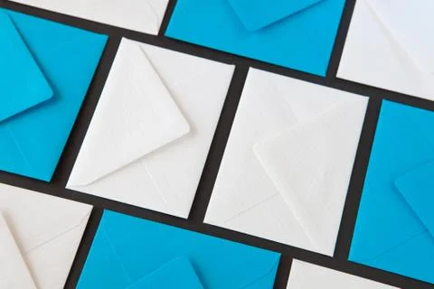 Composition with white and blue envelopes on the table. 库存照片