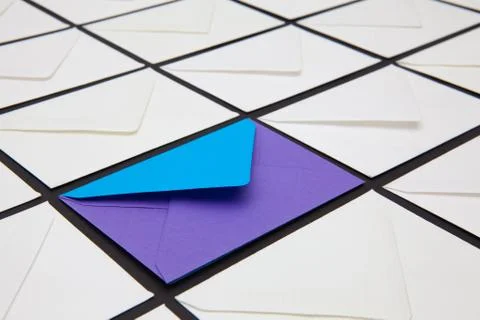 Composition with white and colored envelopes on the table. Stock Photos