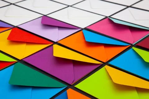 Composition with white and colored envelopes on the table. 库存照片