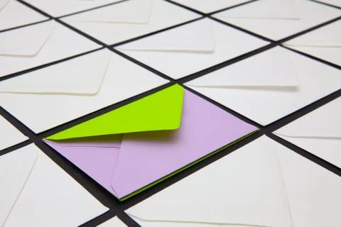 Composition with white and colored envelopes on the table. Photos