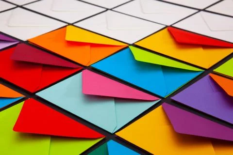 Composition with white and colored envelopes on the table. Stock Photos
