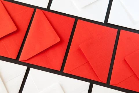 Composition with white and red  envelopes on the table. Photos