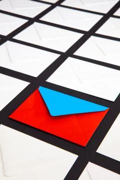 Composition with white and two-color envelopes on the table. 스톡 사진
