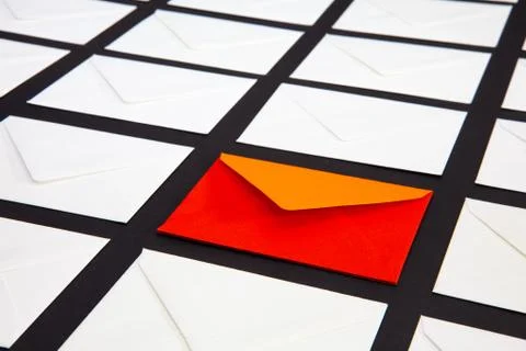 Composition with white and two-color envelopes on the table. Stock Photos