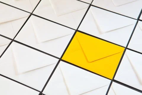 Composition with white and yellow, envelopes on the table. 库存照片