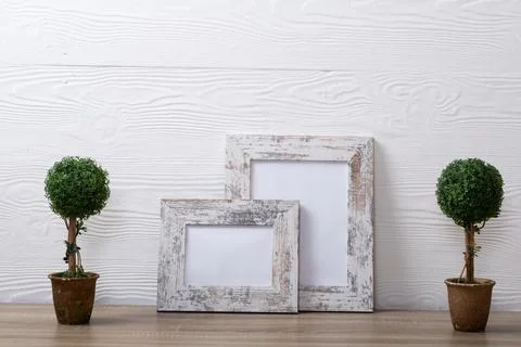 Composition of white cards in frames with copy space and decorations on white Stockfoto's