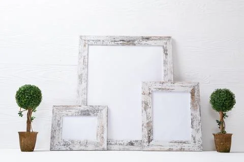 Composition of white cards in frames with copy space and tree decorations on Stock Photos
