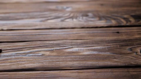 Composition of the white cup with roasted beans of coffee on a wooden table. Stock Footage 130254288
