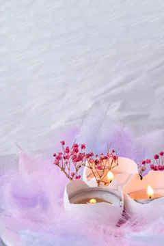 Composition of White egg shell with candle inside. Candle light. Bright easte Stock Photos