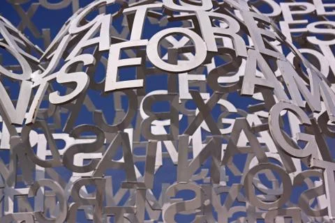 Composition with white letters on a blue sky. Detail of sculpture Nomad, 2010 Stock Photos