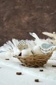 Composition with a wicker basket and eggs for Easter Stock Photos